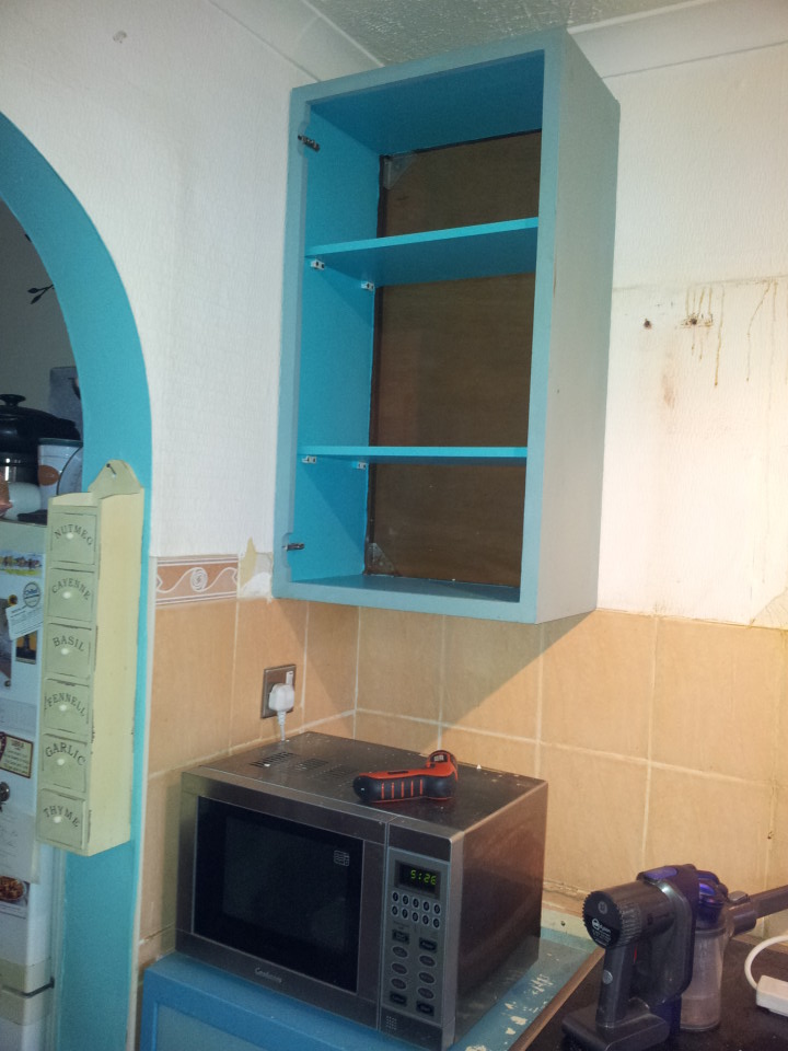 Wall cabinets after we put them up in the old kitchen, as I painted them over a year ago and they were so much better than our old wall cabinets we decided to put them up and use them in the old kitchen too