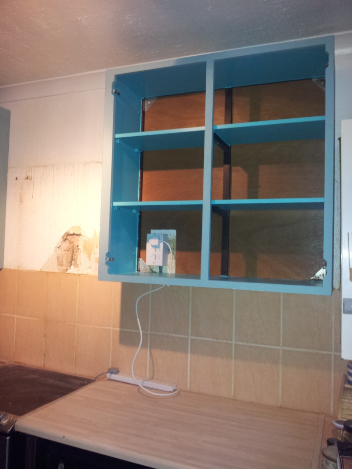 Wall cabinets after we put them up in the old kitchen, as I painted them over a year ago and they were so much better than our old wall cabinets we decided to put them up and use them in the old kitchen too