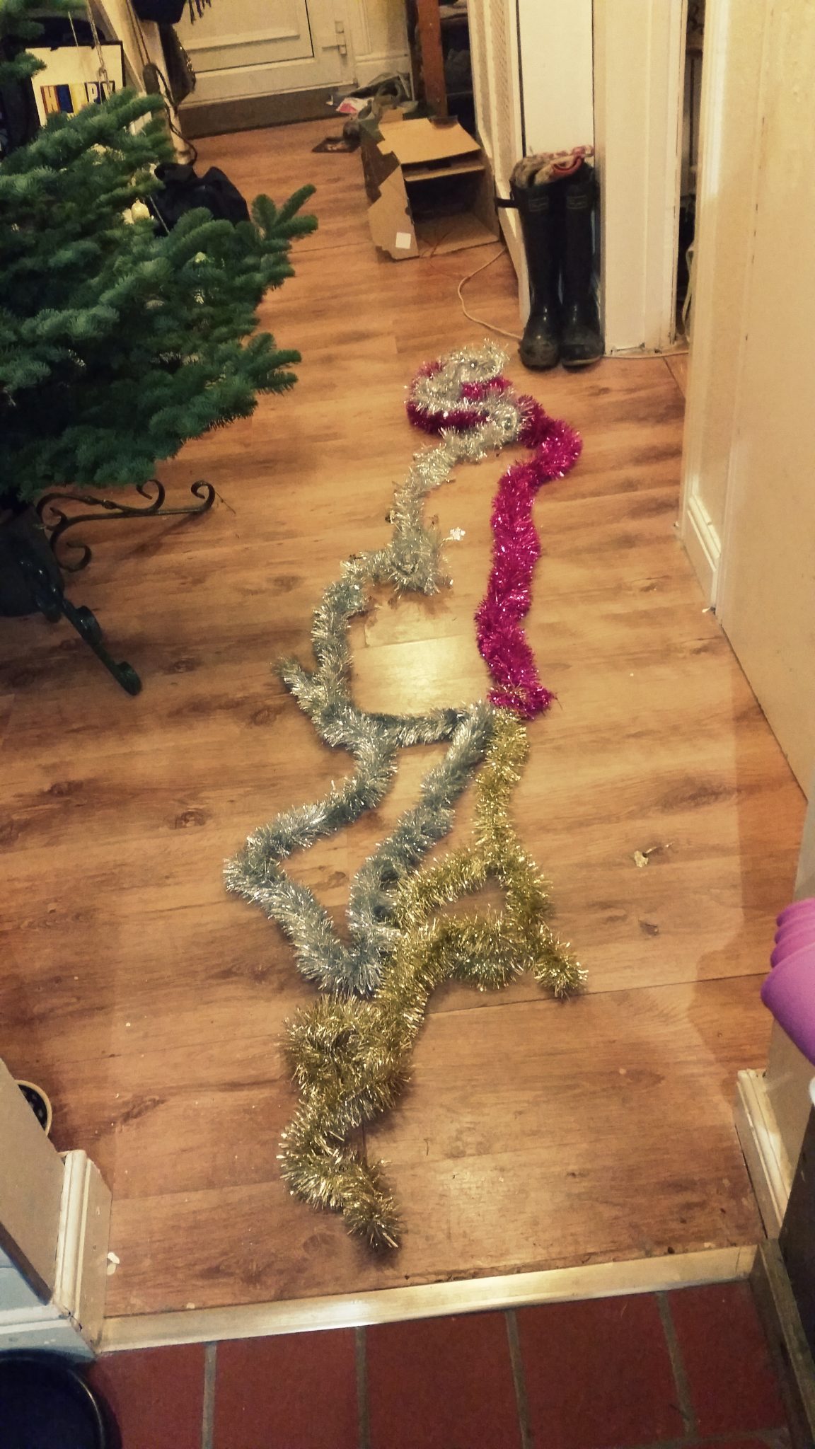 2. Get all your tinsel out {again this is a selection of different donated and charity shop finds, the point is not to be fancy but to create depth} and tie them all together so you have one long piece - basic granny knot will do