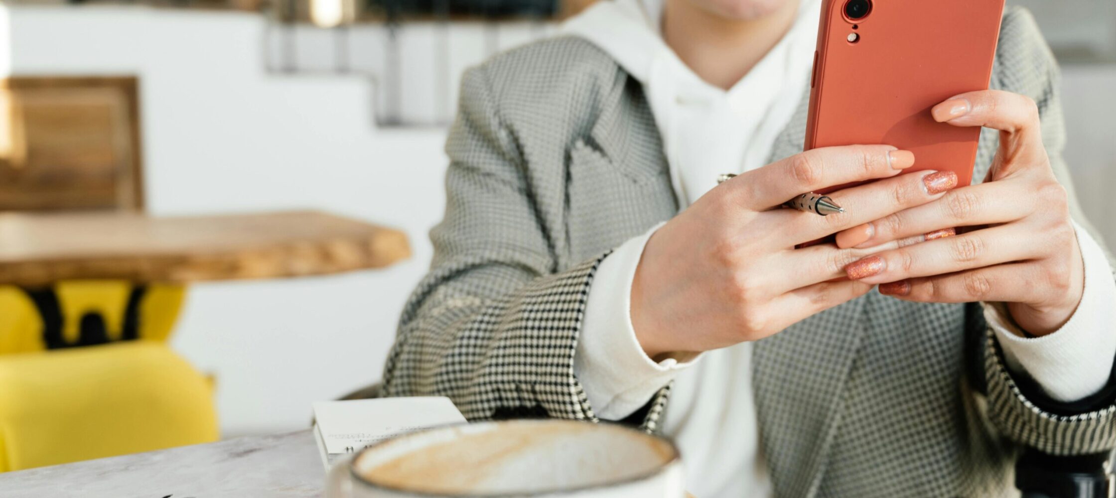 Small business owner using phone to manage Instagram 6 Grid design